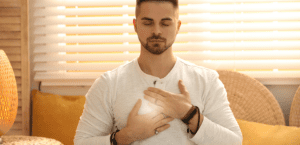 Young man during self-healing session in therapy room.